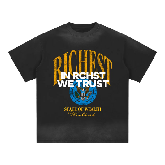 Asphalt gray RCHST graphic tee with yellow RICHEST lettering, white IN RCHST WE TRUST text, and blue seal